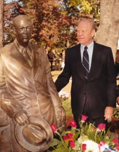 Former President Gerald R. Ford poses by the Eisenhower Statue, 1983