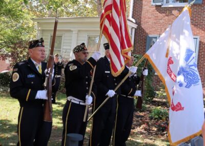 The Allied Veterans Honor Guard plays Taps prior to retiring the colors.