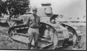 Eisenhower poses next to Renault tank, Camp Meade, Maryland 1919