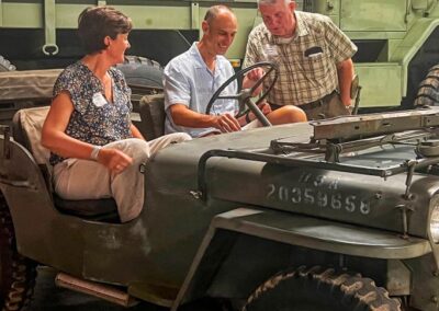 2026 At Ease Event: Bill discussed the equipment while Dave and Heather listened.
