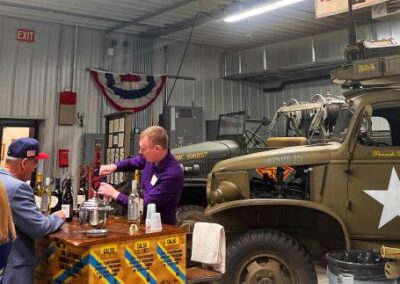 2026 At Ease Event: There was a steady line at the bar. Thank you, Duane and Linda Williams, for the donation of the wine.