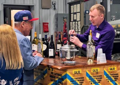 2026 At Ease Event: Andrew talked with visitors while serving the wine.