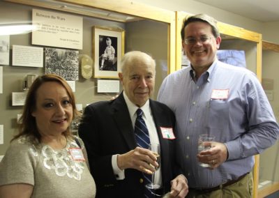 Supt. Clark (right) and guests enjoy the beverages